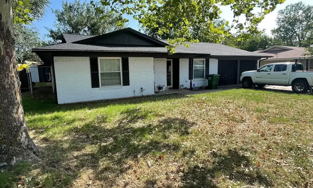Professional roofing crew working on a residential roof in Vergennes
